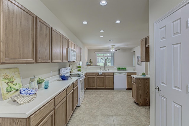 kitchen with kitchen peninsula, light tile patterned flooring, white appliances, and ceiling fan