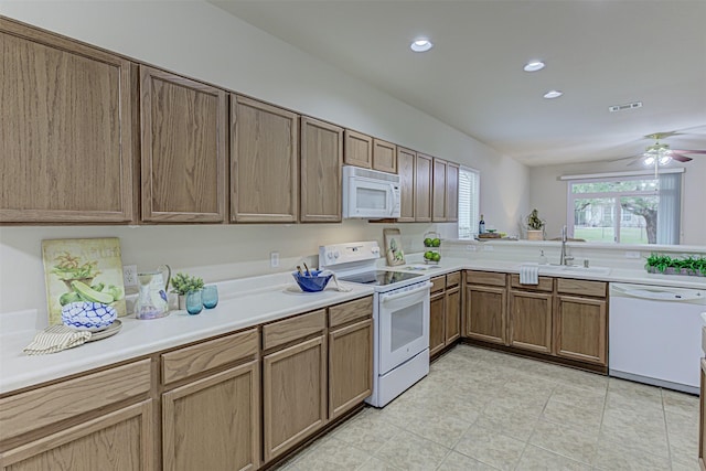 kitchen with ceiling fan, sink, and white appliances