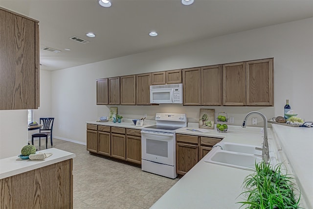 kitchen with sink and white appliances