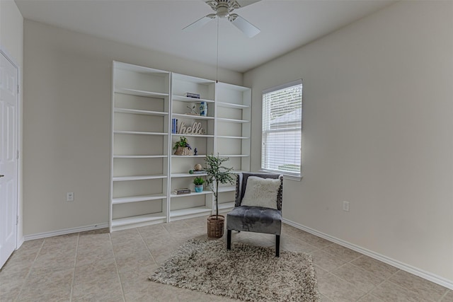 living area with ceiling fan