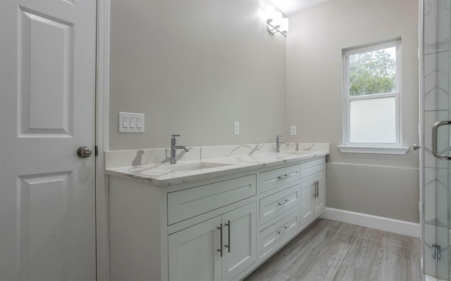 bathroom featuring hardwood / wood-style flooring and vanity