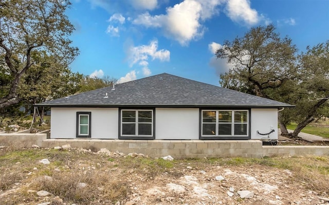 2718 Leslie Ln, San Marcos, TX 78666 - view of side of home with roof with shingles and stucco siding