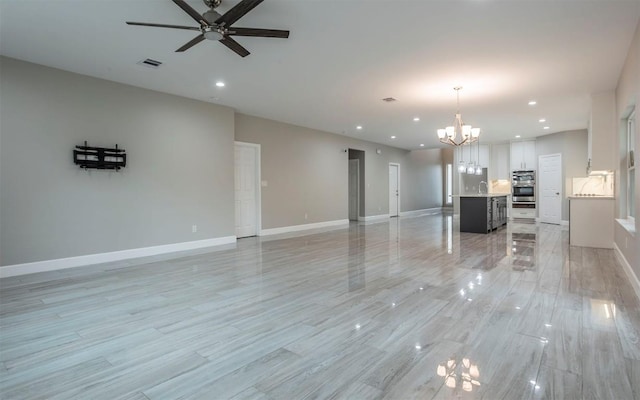 2718 Leslie Ln, San Marcos, TX 78666 - unfurnished living room with a ceiling fan, a chandelier, recessed lighting, and light wood finished floors