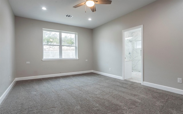 carpeted empty room featuring ceiling fan