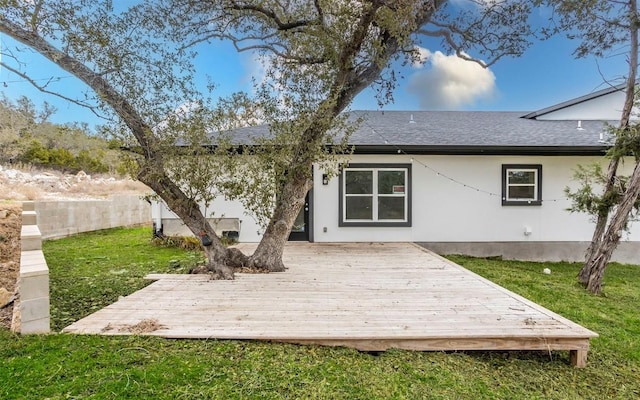 2718 Leslie Ln, San Marcos, TX 78666 - back of property with a deck, a shingled roof, a yard, and stucco siding