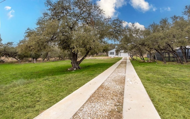 2718 Leslie Ln, San Marcos, TX 78666 - view of home's community with a lawn and a garage