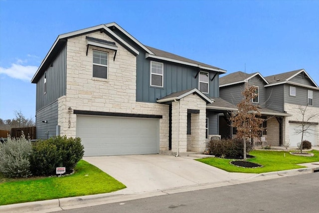 view of front facade with a garage and a front lawn