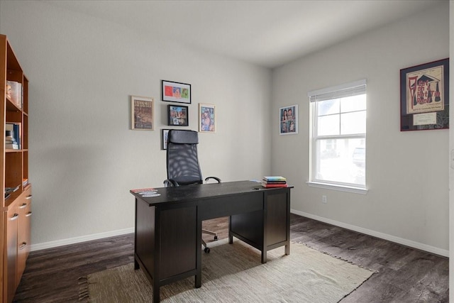 office space with dark wood-type flooring