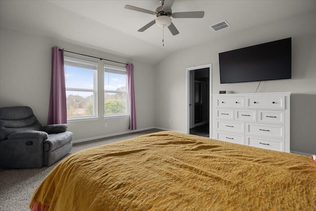 bedroom featuring ceiling fan, light colored carpet, a spacious closet, and lofted ceiling