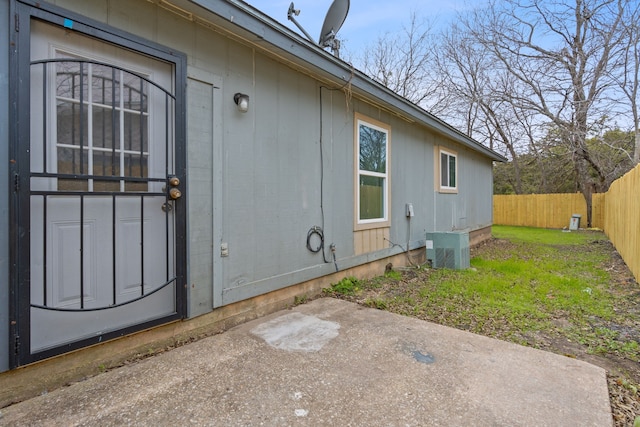 view of exterior entry featuring a patio