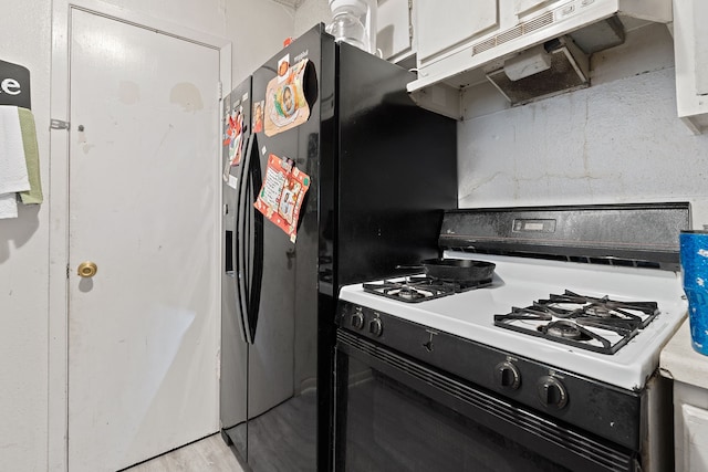 kitchen with white cabinetry and range with gas stovetop