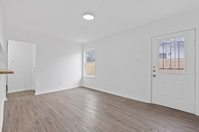 unfurnished living room featuring light hardwood / wood-style floors