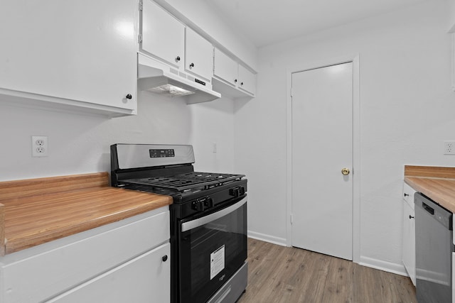 kitchen with light wood-type flooring, stainless steel appliances, and white cabinetry