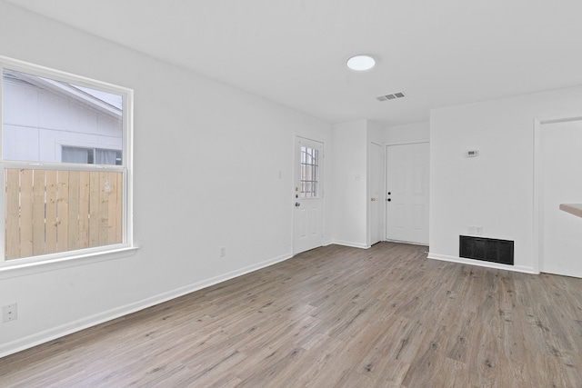 unfurnished room with light hardwood / wood-style floors