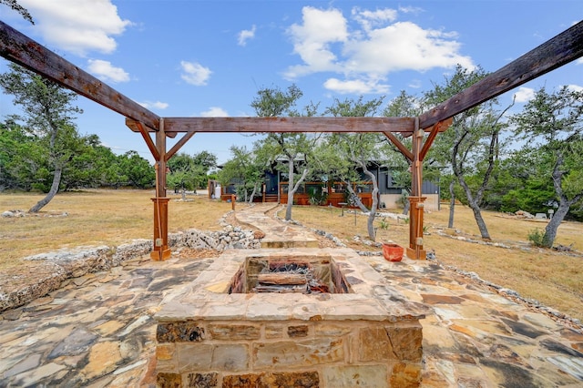 view of patio with a fire pit