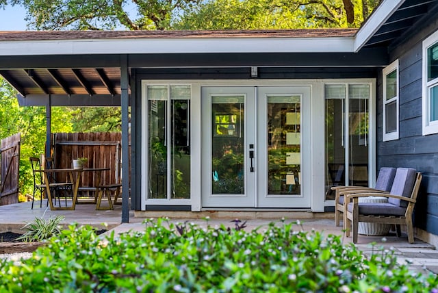 view of exterior entry featuring french doors