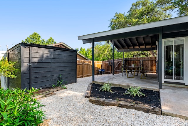 view of patio / terrace featuring a shed