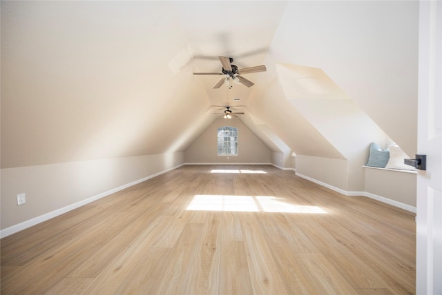 bonus room with light hardwood / wood-style floors and vaulted ceiling