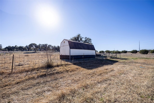 view of outbuilding with a rural view