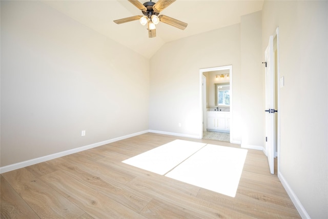 spare room with light wood-type flooring, ceiling fan, and lofted ceiling