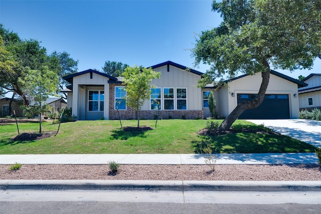 view of front of home featuring a garage and a front lawn