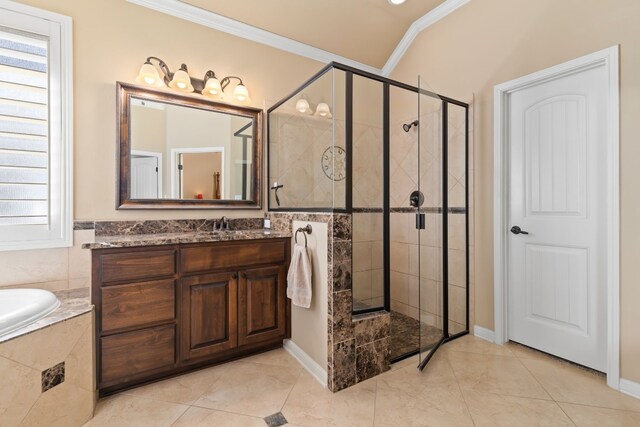 bathroom featuring crown molding, vanity, vaulted ceiling, tile patterned floors, and independent shower and bath