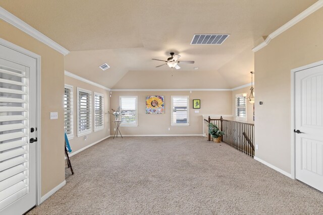 interior space featuring baseboards, visible vents, and crown molding