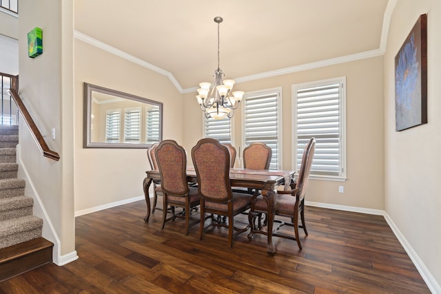 dining space with crown molding, plenty of natural light, dark hardwood / wood-style floors, and a chandelier