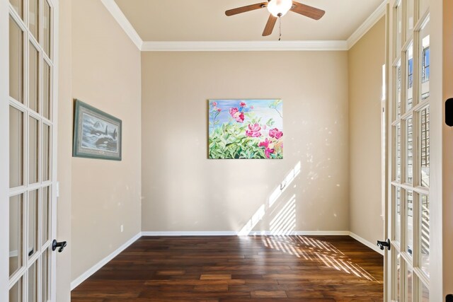 empty room featuring crown molding, dark hardwood / wood-style floors, and french doors