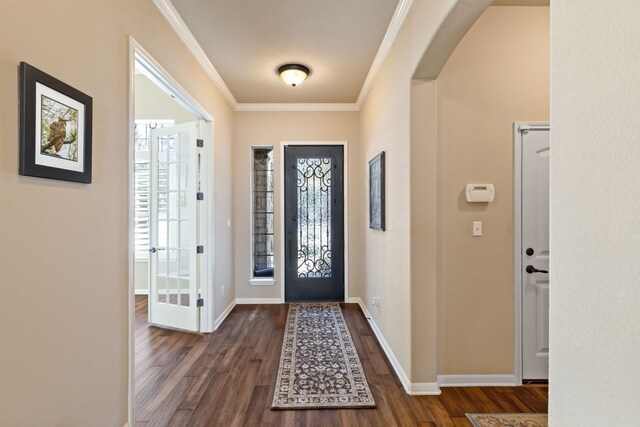 foyer featuring crown molding and dark hardwood / wood-style flooring