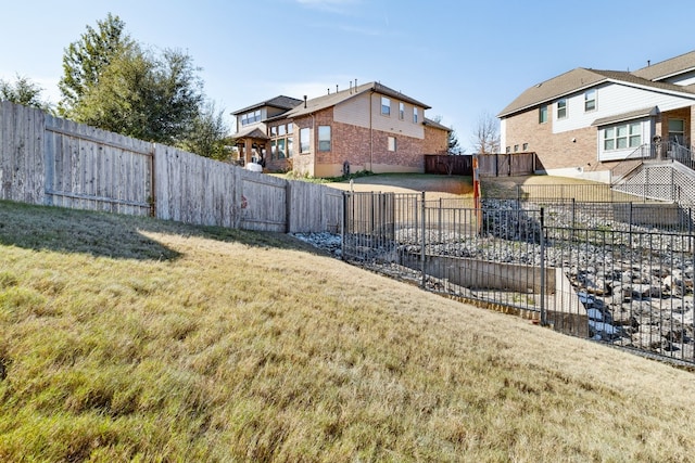 view of yard with a fenced backyard