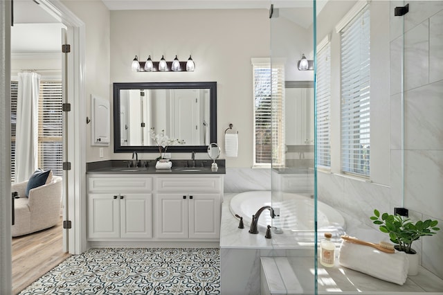 bathroom with vanity, independent shower and bath, and tile patterned floors