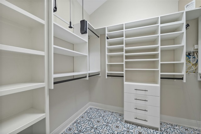 11716 Shadestone Ter, Austin, TX 78732 - walk in closet with light tile patterned floors