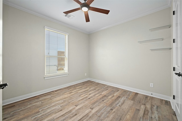 empty room with light wood-type flooring, ceiling fan, and crown molding