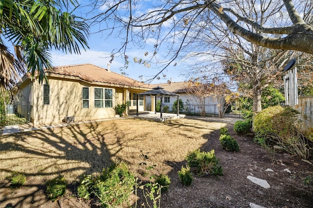 11716 Shadestone Ter, Austin, TX 78732 - back of property with a gazebo, a patio area, and a tile roof