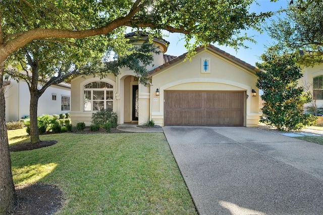 11716 Shadestone Ter, Austin, TX 78732 - mediterranean / spanish-style house featuring a garage, stucco siding, a front yard, and driveway