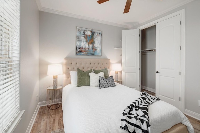 11716 Shadestone Ter, Austin, TX 78732 - bedroom with wood finished floors, baseboards, crown molding, ceiling fan, and a closet