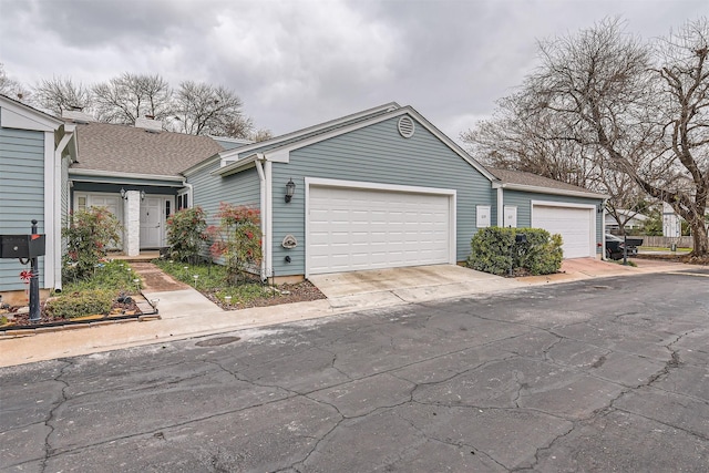 single story home featuring a garage