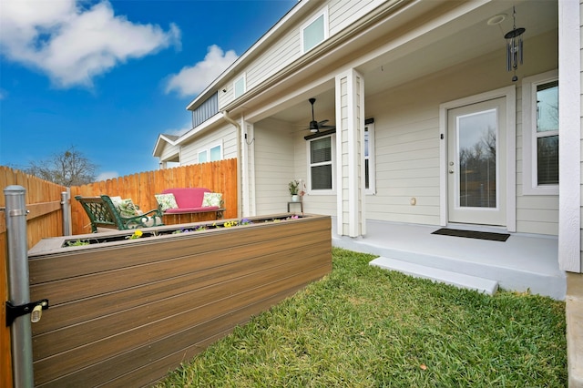 exterior space with ceiling fan