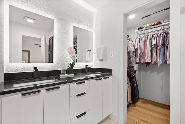 bathroom featuring hardwood / wood-style flooring and vanity