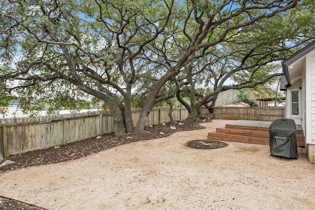 view of yard with a wooden deck