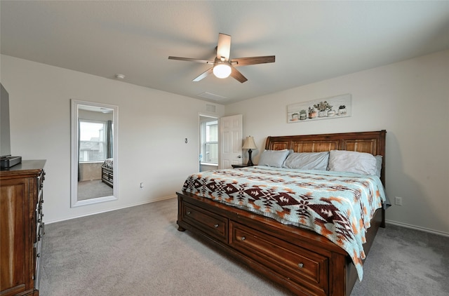 carpeted bedroom featuring ceiling fan