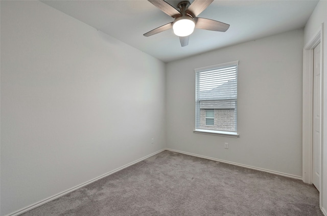 carpeted empty room with ceiling fan