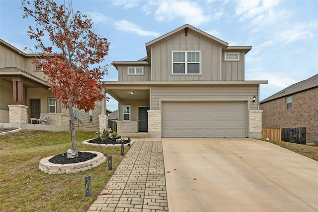 view of front of house with a front yard and a garage