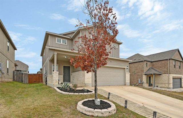 view of front of home with a garage and a front yard