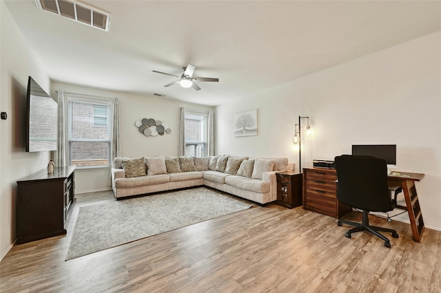 office area featuring ceiling fan and light wood-type flooring