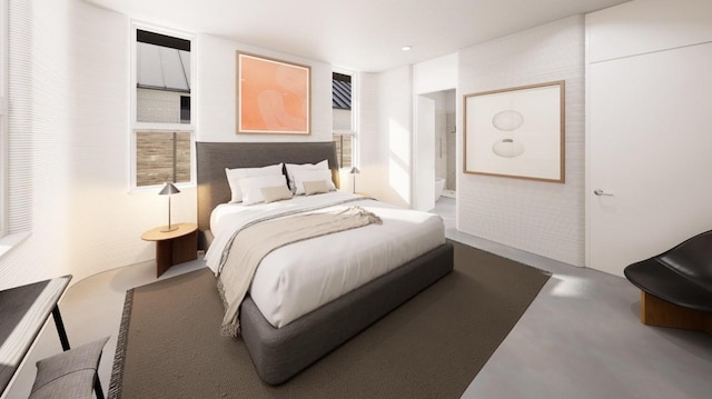 bedroom featuring concrete flooring