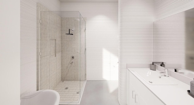 bathroom featuring a shower with shower door and vanity