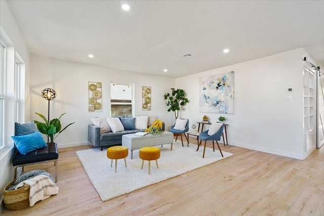 6811 Montana St, Austin, TX 78741 - living area featuring light wood finished floors, baseboards, recessed lighting, and plenty of natural light