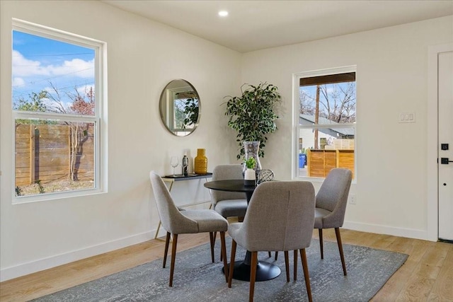 6811 Montana St, Austin, TX 78741 - dining room with light wood-type flooring, baseboards, and recessed lighting